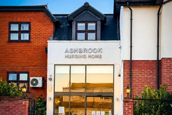 The grand Tudor-style exterior of Ashbrook Nursing Home in Collier Row, Romford